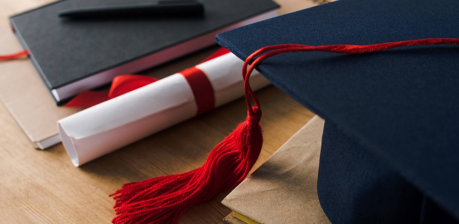 LMS Integrations: Tools and Features Every University Should Know About selective focus of notebooks with pen diploma and 3k7p2rq